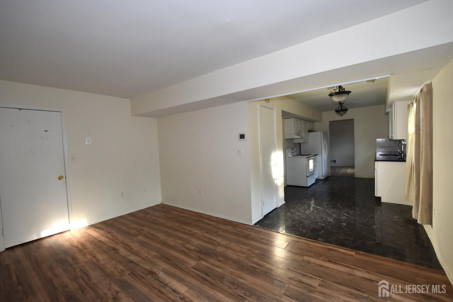 8 Wethersfield Road Plainsboro, NJ 08536 - Photo 11 of 28 a view of a room with wooden floor and a bathroom