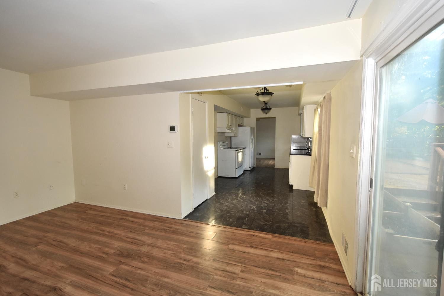 8 Wethersfield Road Plainsboro, NJ 08536 - Photo 12 of 28 a view of a hallway with wooden floor and a bathroom