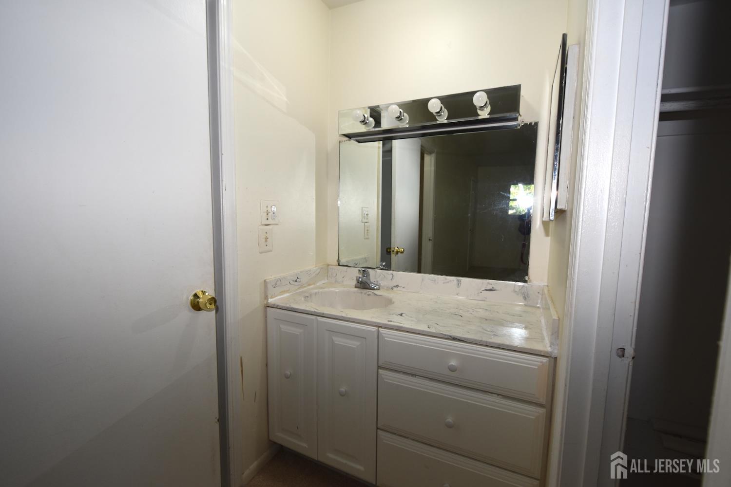 8 Wethersfield Road Plainsboro, NJ 08536 - Photo 18 of 28 a bathroom with a granite countertop sink mirror and vanity