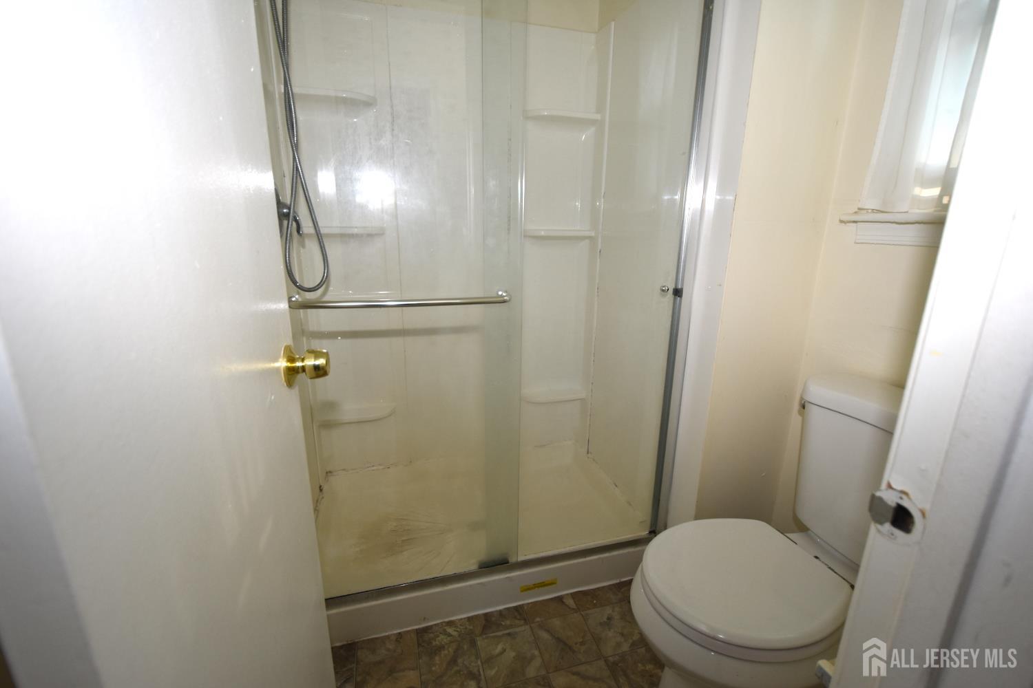 8 Wethersfield Road Plainsboro, NJ 08536 - Photo 19 of 28 a bathroom with a toilet and a shower