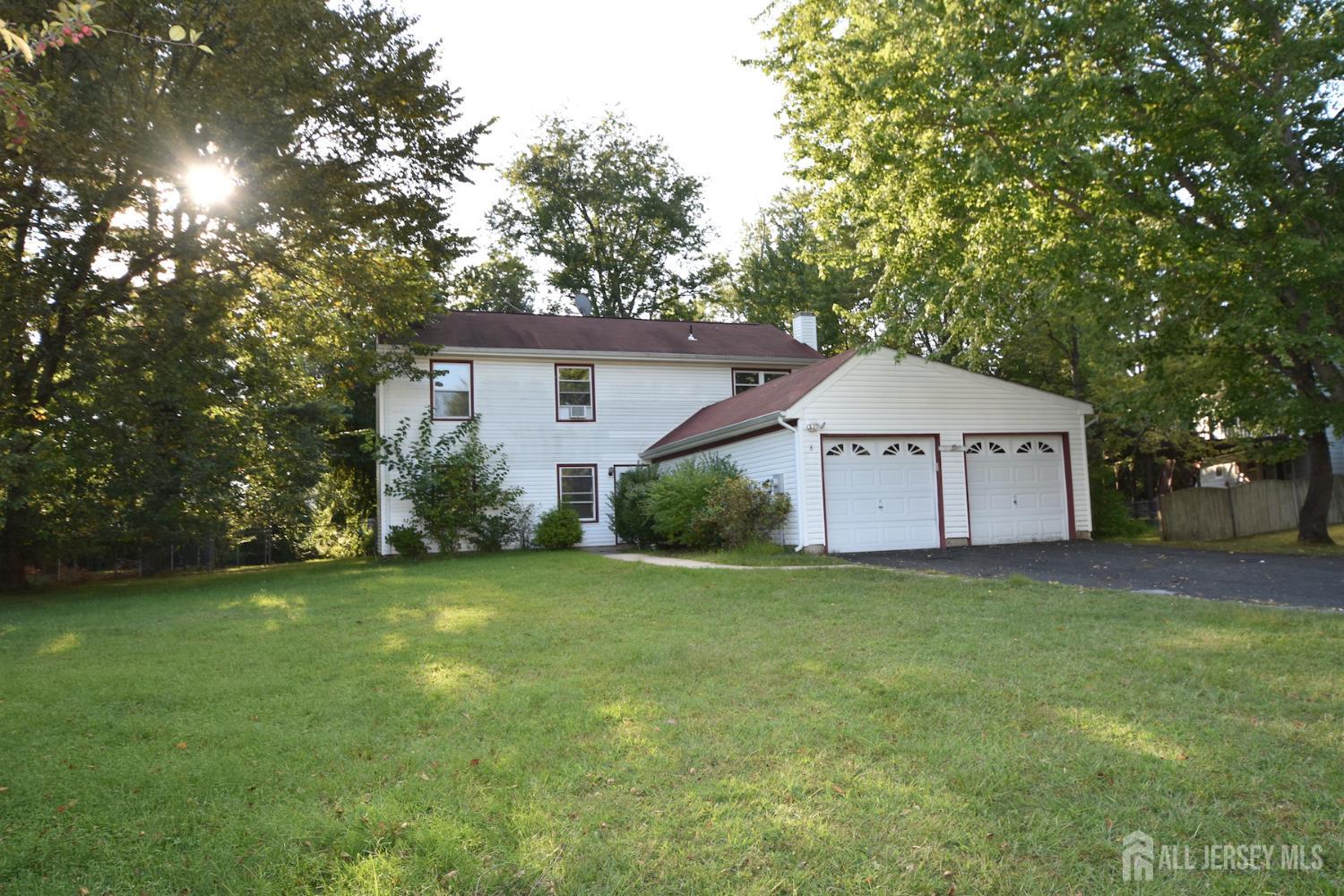 8 Wethersfield Road Plainsboro, NJ 08536 - Photo 2 of 28 a house that has a tree in front of it