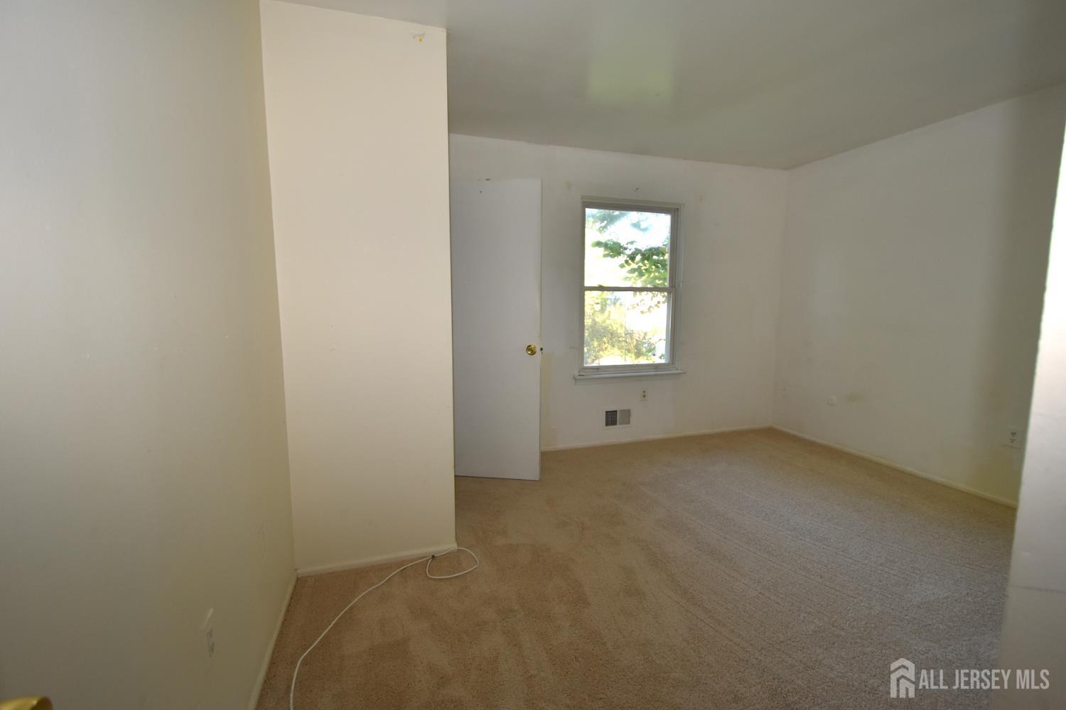 8 Wethersfield Road Plainsboro, NJ 08536 - Photo 22 of 28 a view of an empty room with a window