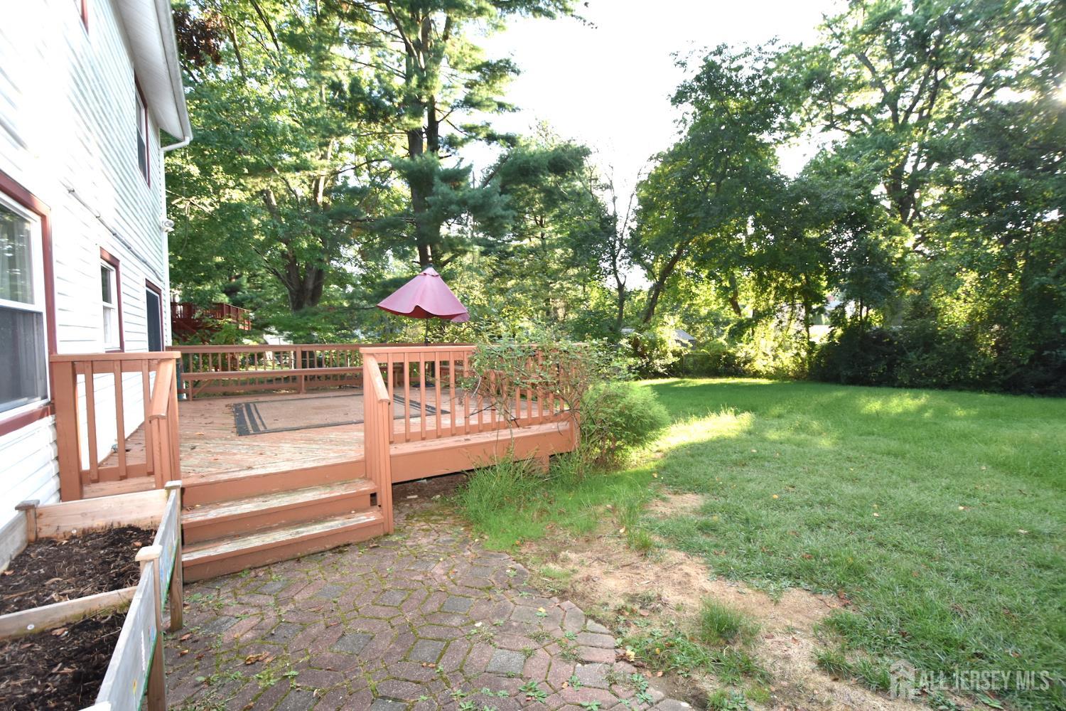 8 Wethersfield Road Plainsboro, NJ 08536 - Photo 26 of 28 a view of yard with deck and garden