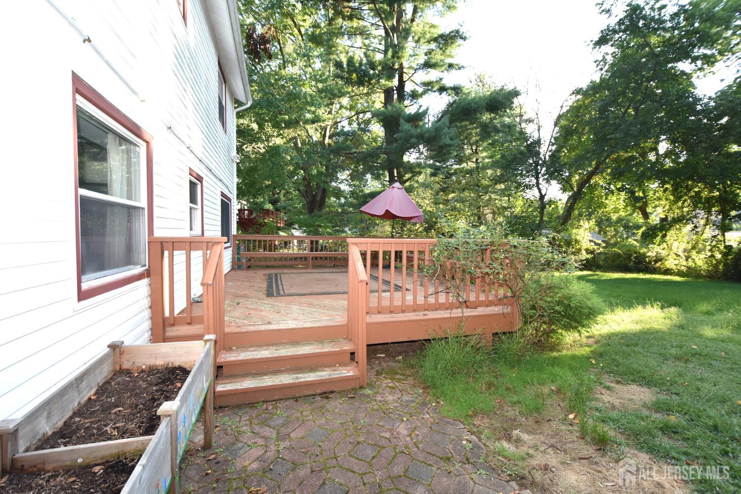 8 Wethersfield Road Plainsboro, NJ 08536 - Photo 28 of 28 a view of house with backyard outdoor seating and hardwood