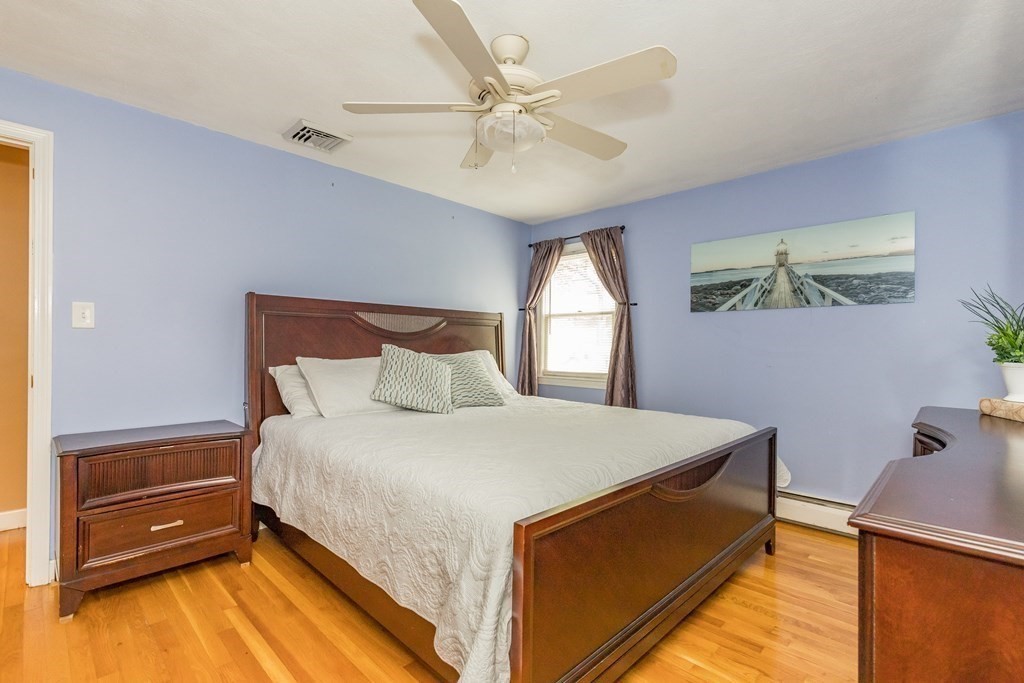 2 Marilyn Road Billerica, MA 01821 - Photo 14 of 32 a bedroom with a bed and a chandelier