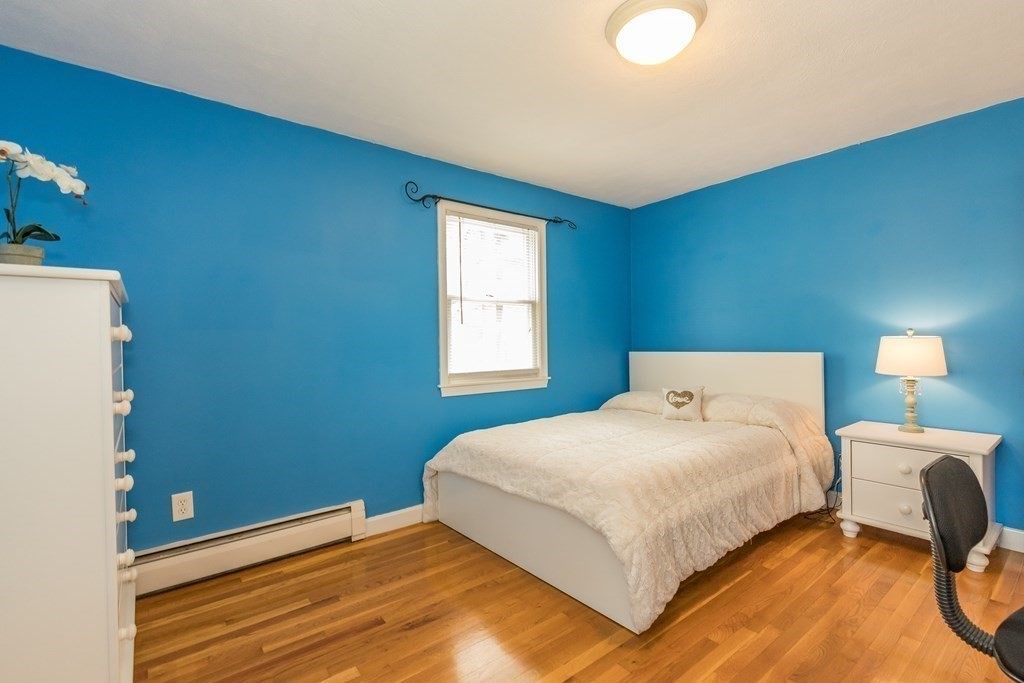 2 Marilyn Road Billerica, MA 01821 - Photo 15 of 32 a bedroom with a bed and a lamp