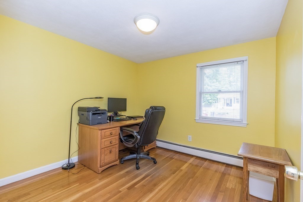2 Marilyn Road Billerica, MA 01821 - Photo 17 of 32 a view of a workspace with furniture and wooden floor