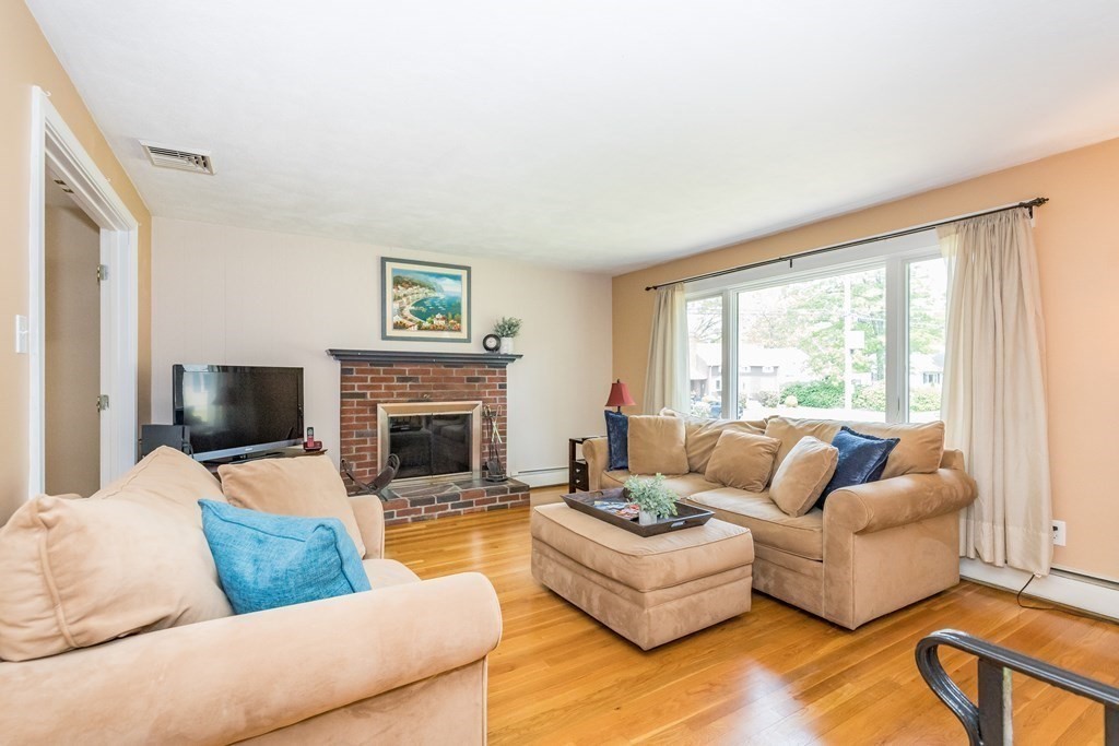 2 Marilyn Road Billerica, MA 01821 - Photo 2 of 32 a living room with furniture large window and a fireplace