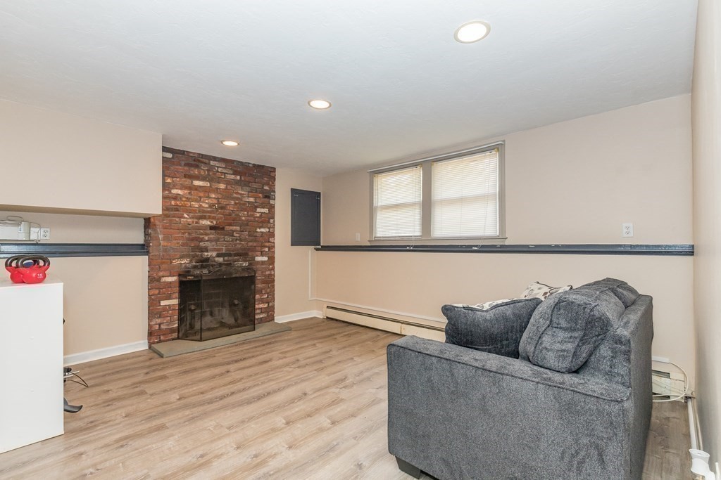 2 Marilyn Road Billerica, MA 01821 - Photo 21 of 32 a living room with furniture and a fireplace