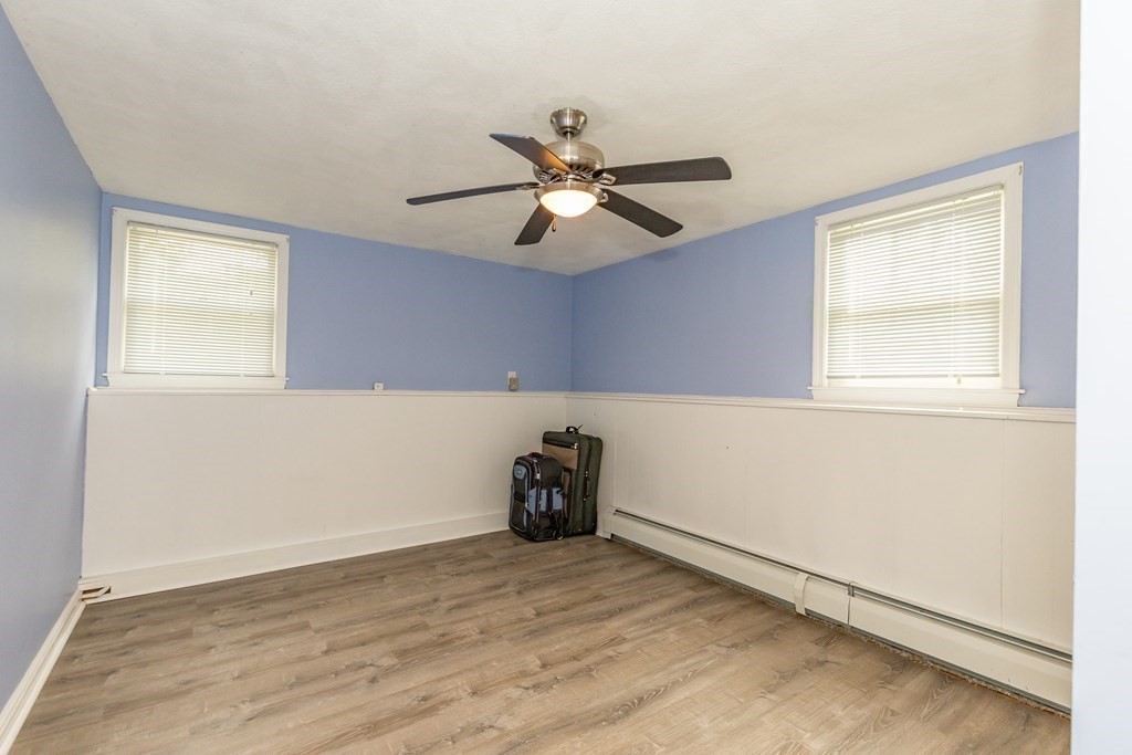 2 Marilyn Road Billerica, MA 01821 - Photo 24 of 32 a room with chandelier fan and windows