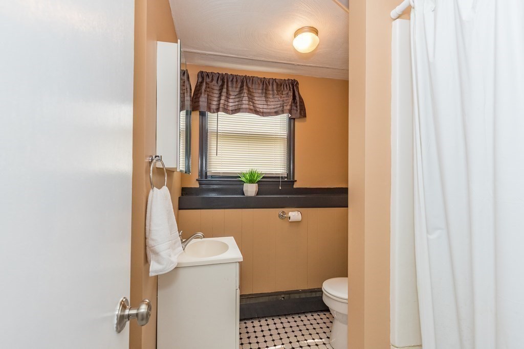 2 Marilyn Road Billerica, MA 01821 - Photo 25 of 32 a bathroom with a sink and a mirror