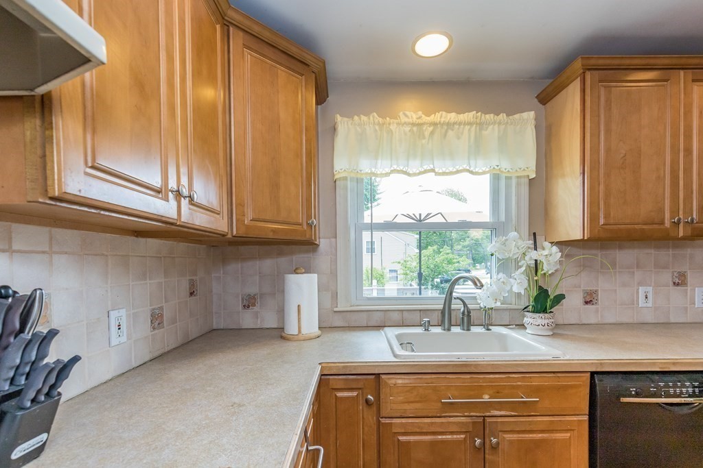 2 Marilyn Road Billerica, MA 01821 - Photo 8 of 32 a kitchen with stainless steel appliances granite countertop a sink and a window