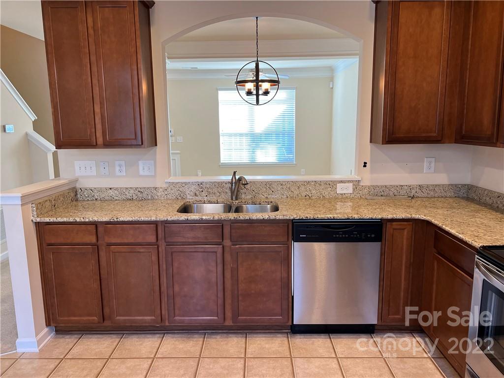 2016 Aston Mill Place Charlotte, NC 28273 - Photo 7 of 13 a kitchen with granite countertop cabinets and window
