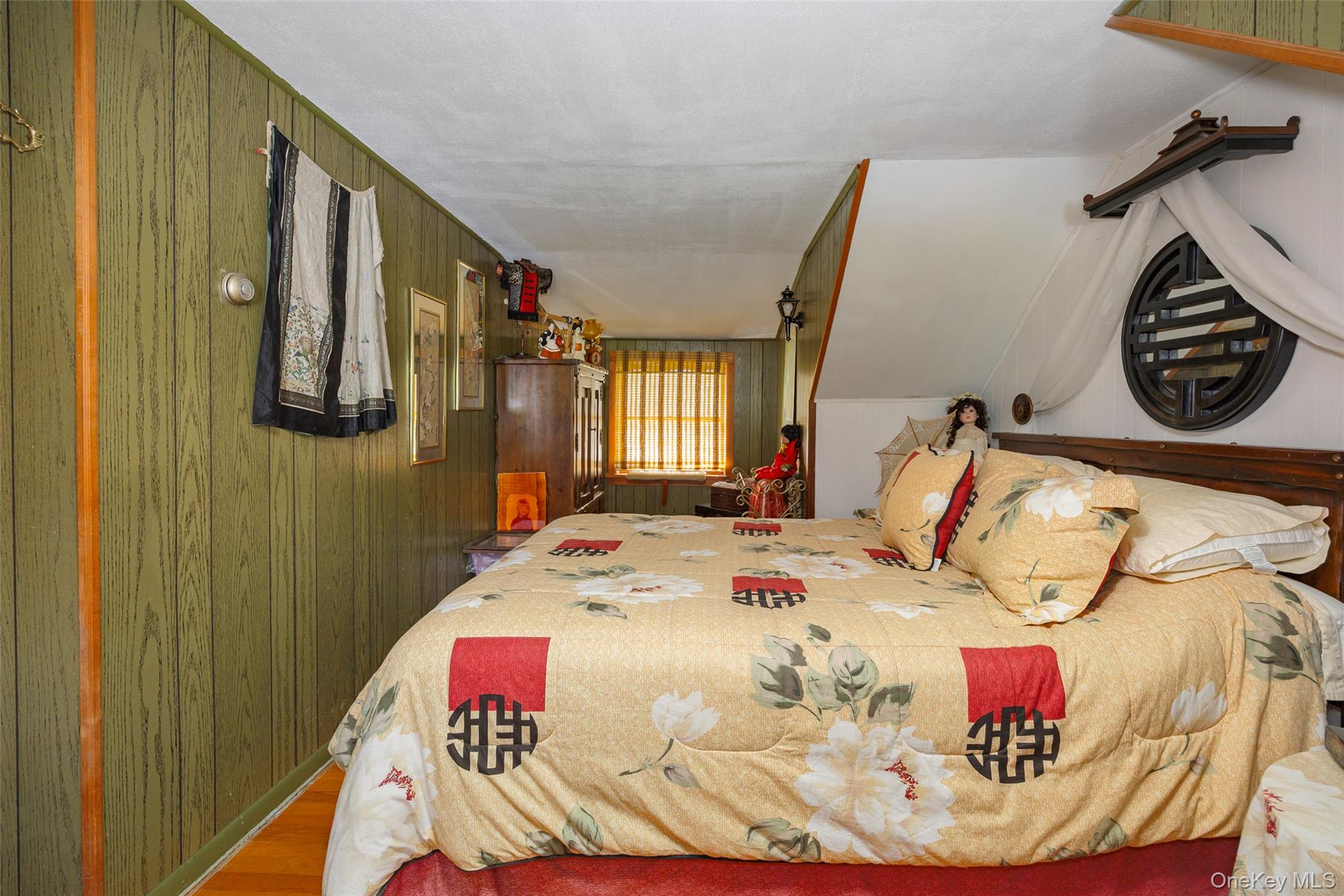 89 Deer Pond Road Verbank, NY 12585 - Photo 26 of 40 a bedroom with a bed and dresser next to a window