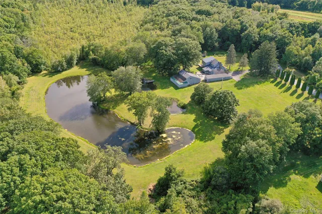 an aerial view of residential house with beach