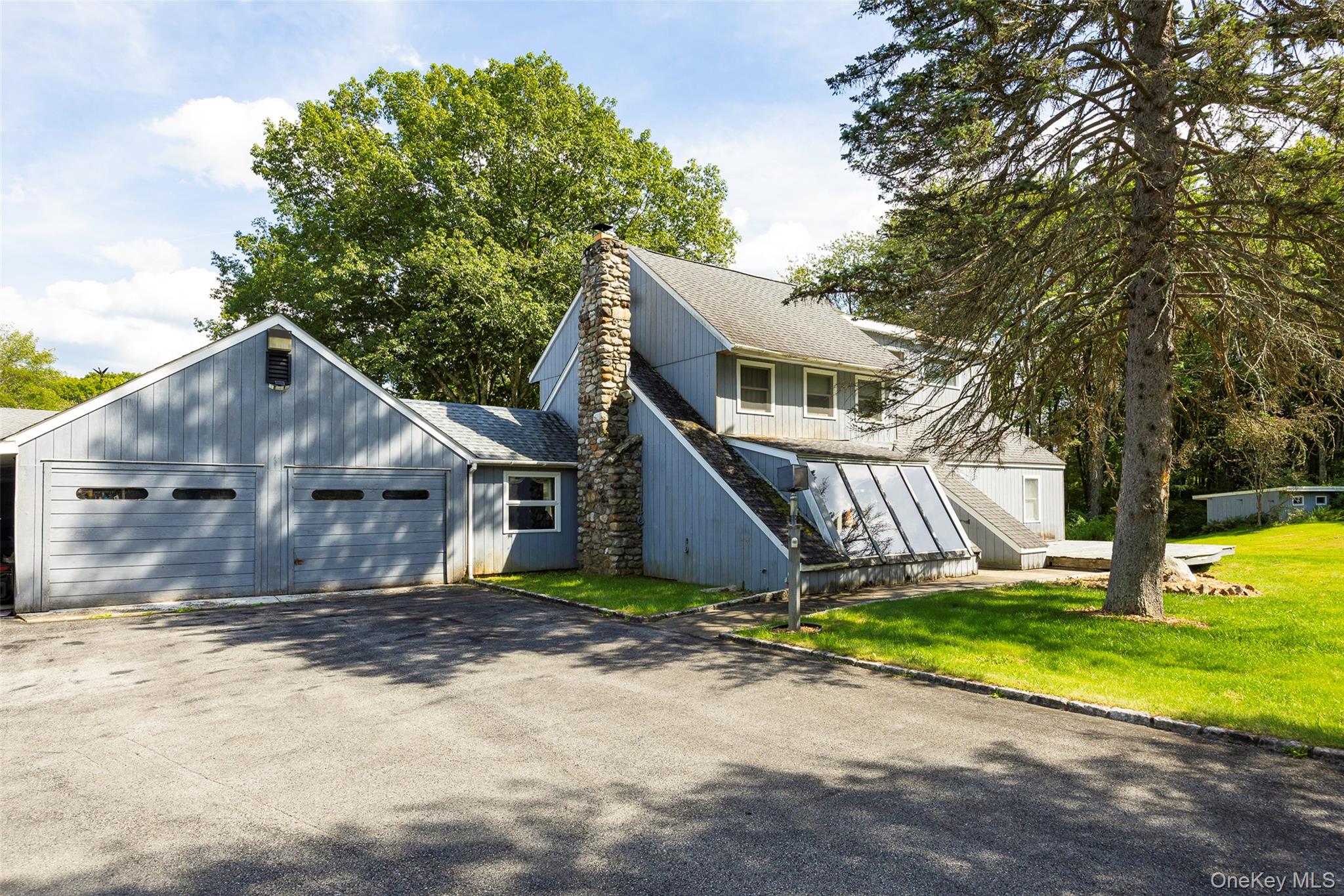 89 Deer Pond Road Verbank, NY 12585 - Photo 7 of 40 a house that has a tree in front of it