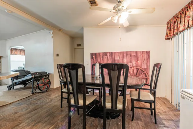 a dining room with furniture and window
