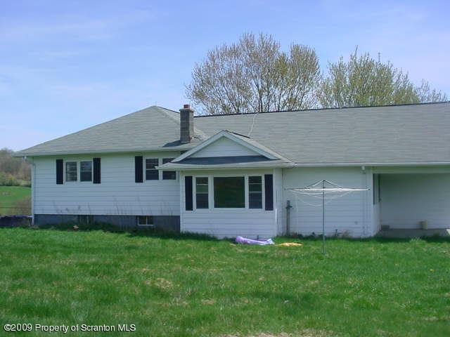 Rr Springville, PA 18844 - Photo 2 of 9 a view of a house with a yard
