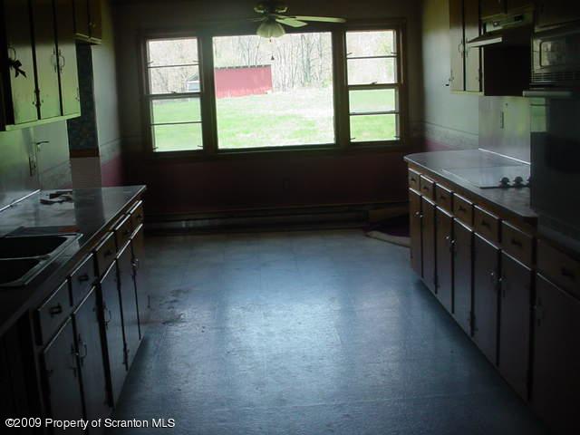 Rr Springville, PA 18844 - Photo 5 of 9 a kitchen with a window a sink and a stove