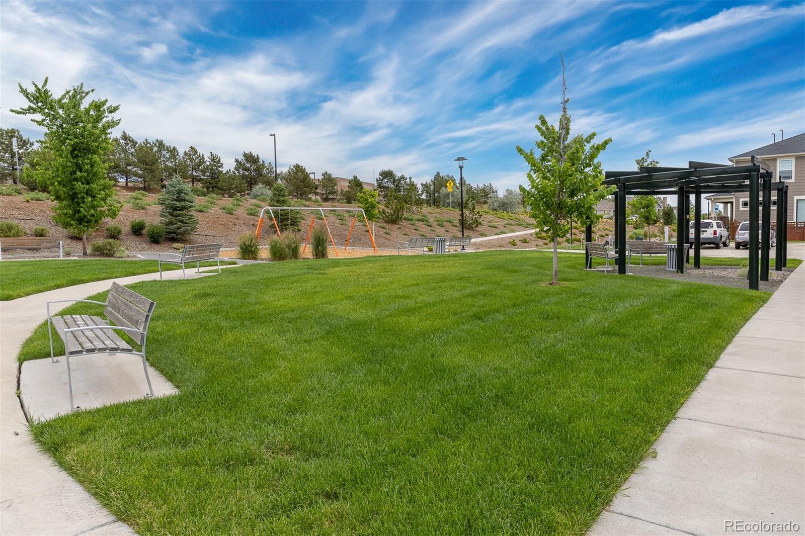 7199 Othello Street Castle Pines, CO 80108 - Photo 27 of 28 a view of a house with a big yard