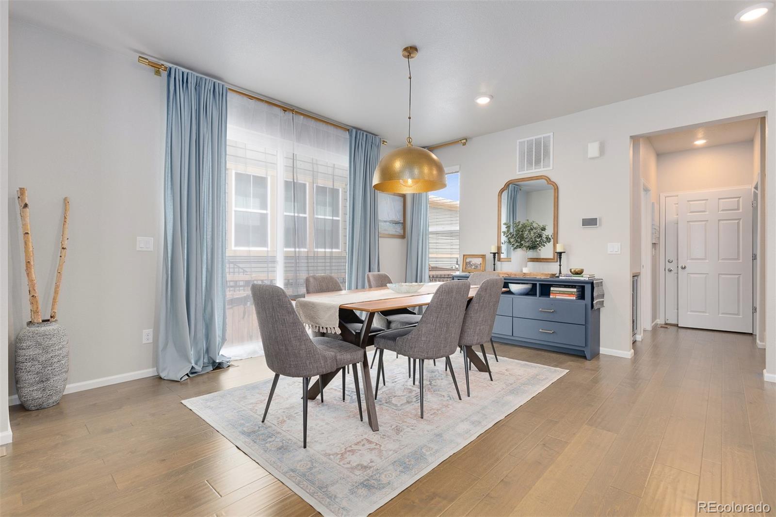 7199 Othello Street Castle Pines, CO 80108 - Photo 8 of 28 a view of a dining room with furniture window and outside view