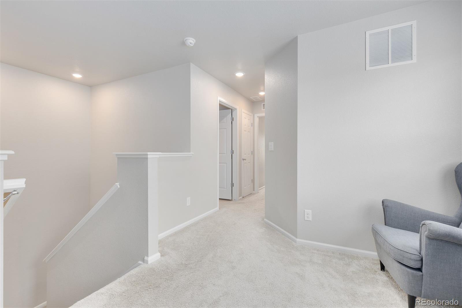 7199 Othello Street Castle Pines, CO 80108 - Photo 10 of 28 a view of a hallway with entryway