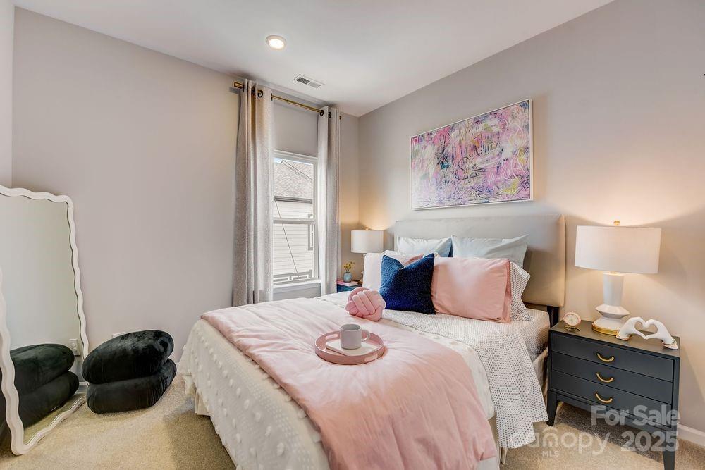 316 Catawba Avenue Davidson, NC 28036 - Photo 29 of 40 a bedroom with a bed and walk in closet