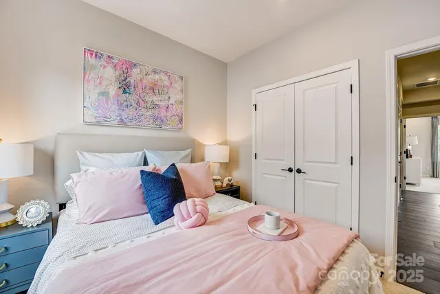 a picture of a bedroom with toys and a large window