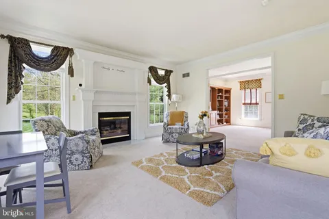 a view of a dining room with furniture and a flat screen tv