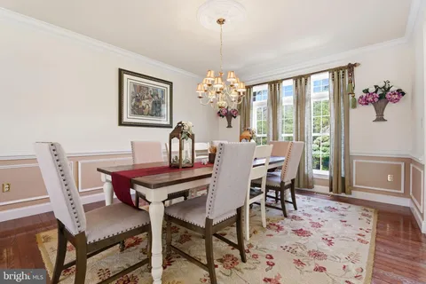 a kitchen with stainless steel appliances granite countertop a sink and a refrigerator
