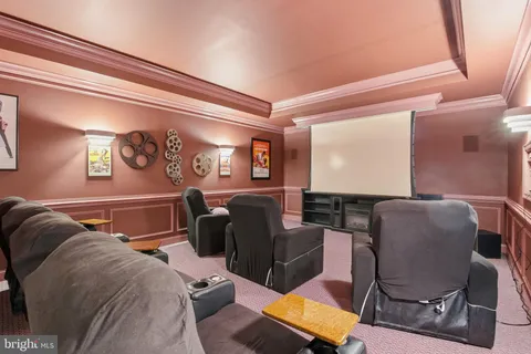 a spacious bedroom with a bed and a chandelier