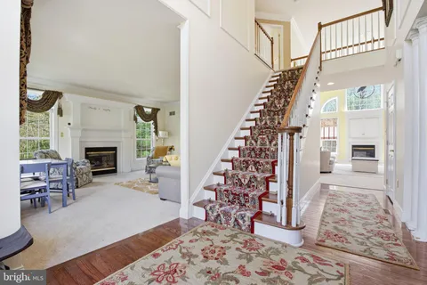a kitchen with kitchen island granite countertop a sink counter top space and cabinets