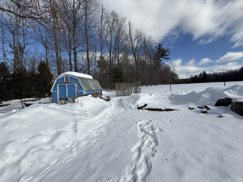 311 Cummington Road Ashfield, MA 01330 - Photo 3 of 11 a view of roof with fire pit and trees around