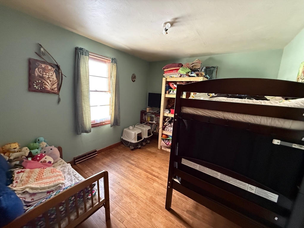 311 Cummington Road Ashfield, MA 01330 - Photo 6 of 11 a bedroom with a bed and a window