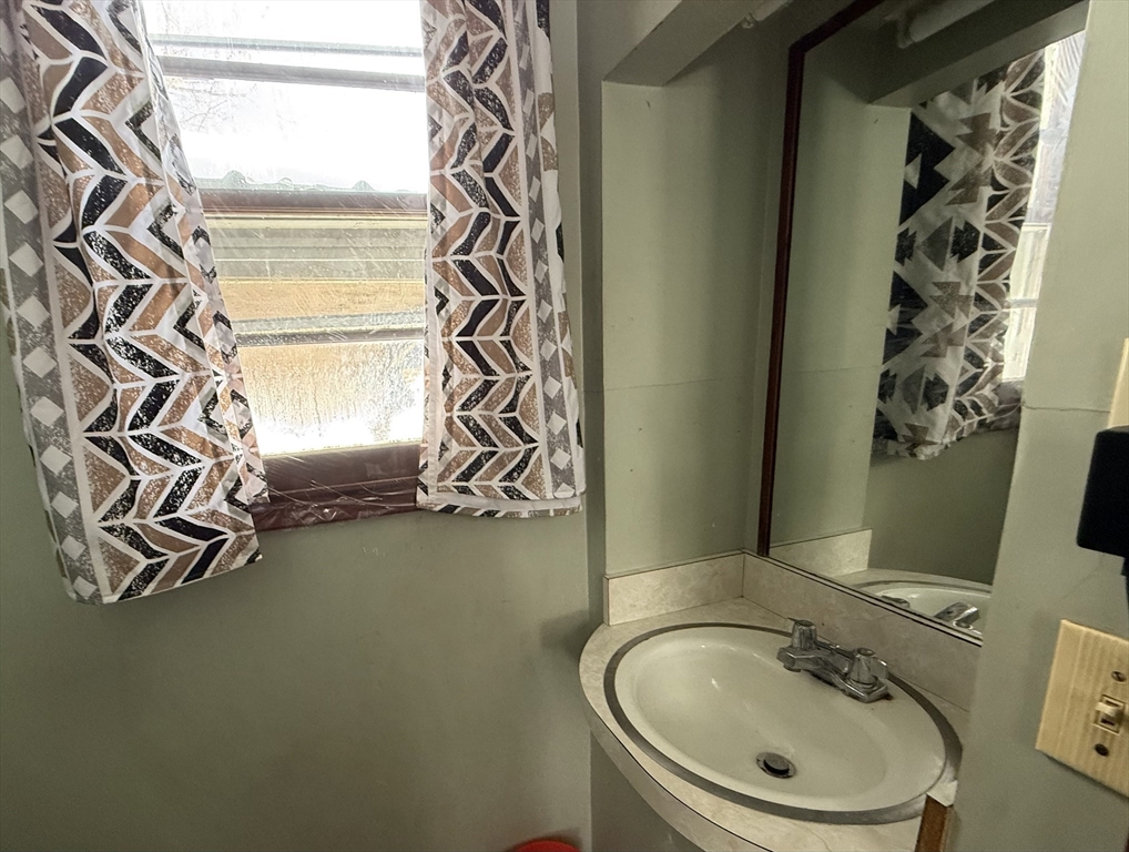 311 Cummington Road Ashfield, MA 01330 - Photo 7 of 11 a bathroom with a sink and a mirror