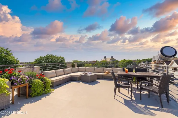 a view of a chairs and table in patio