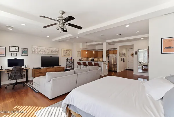 a bed room with two bed and a television