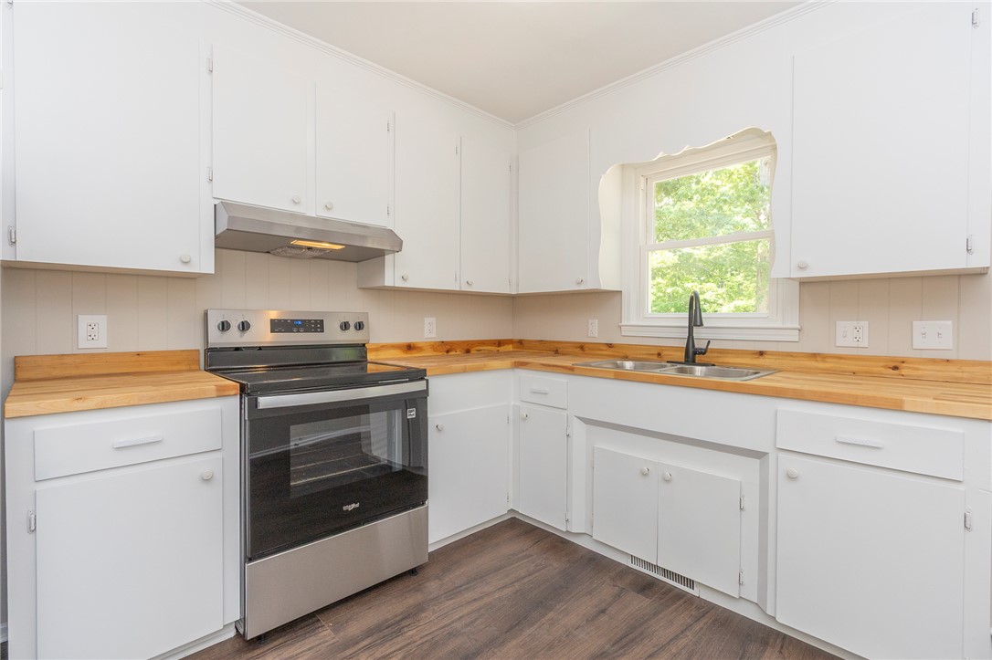 113 Linda Lane Honea Path, SC 29654 - Photo 13 of 36 This kitchen features sleek countertops, modern appliances, and ample cabinet space for all your culinary needs.