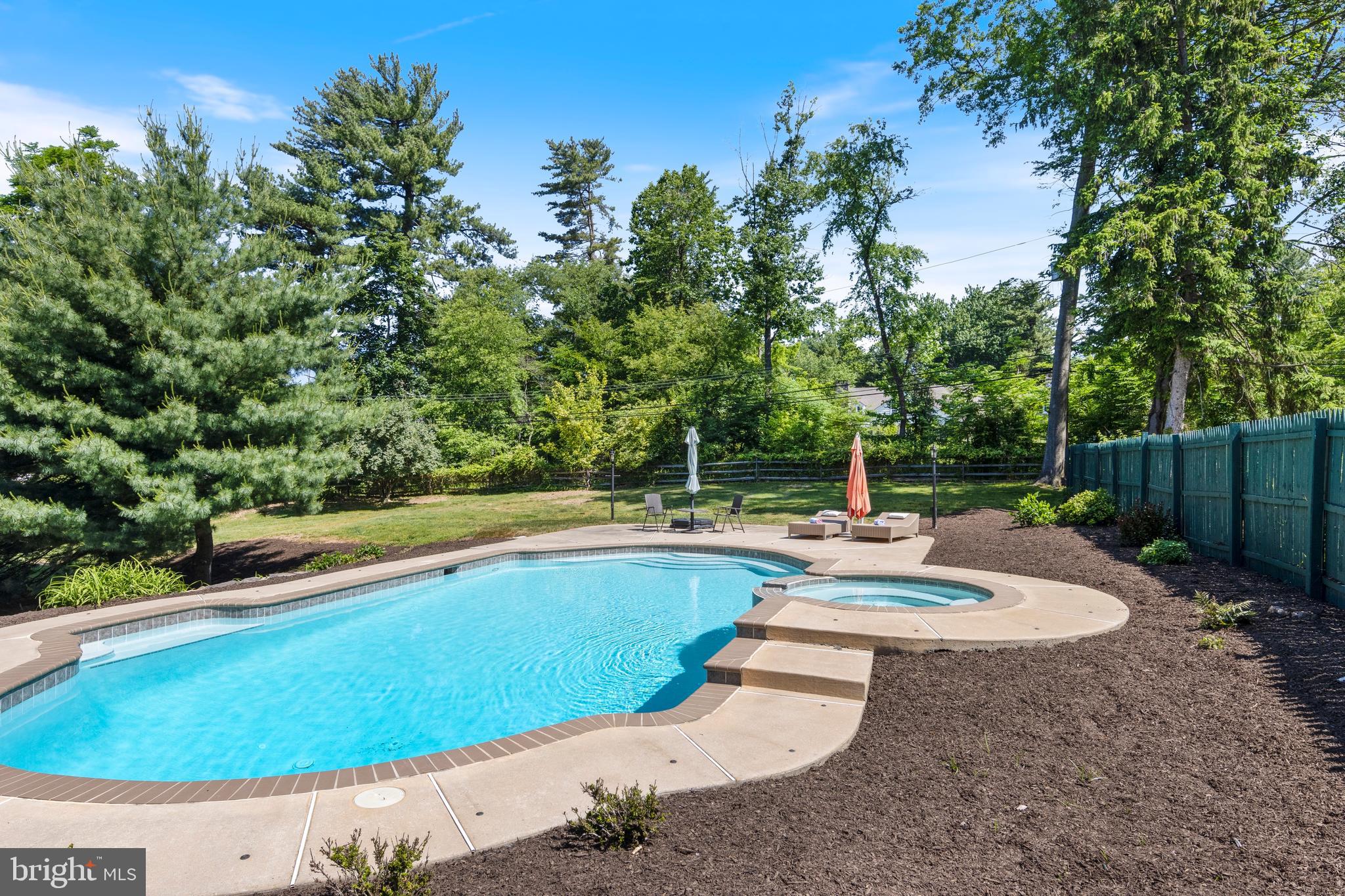 8201 Fenton Road Glenside, PA 19038 - Photo 12 of 86 a view of a swimming pool with a yard and sitting area