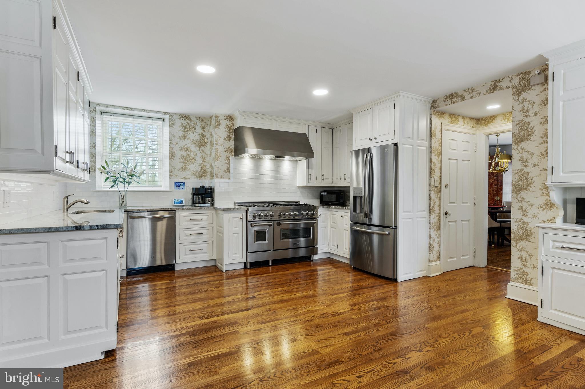 8201 Fenton Road Glenside, PA 19038 - Photo 55 of 86 a kitchen with stainless steel appliances a refrigerator and a stove top oven