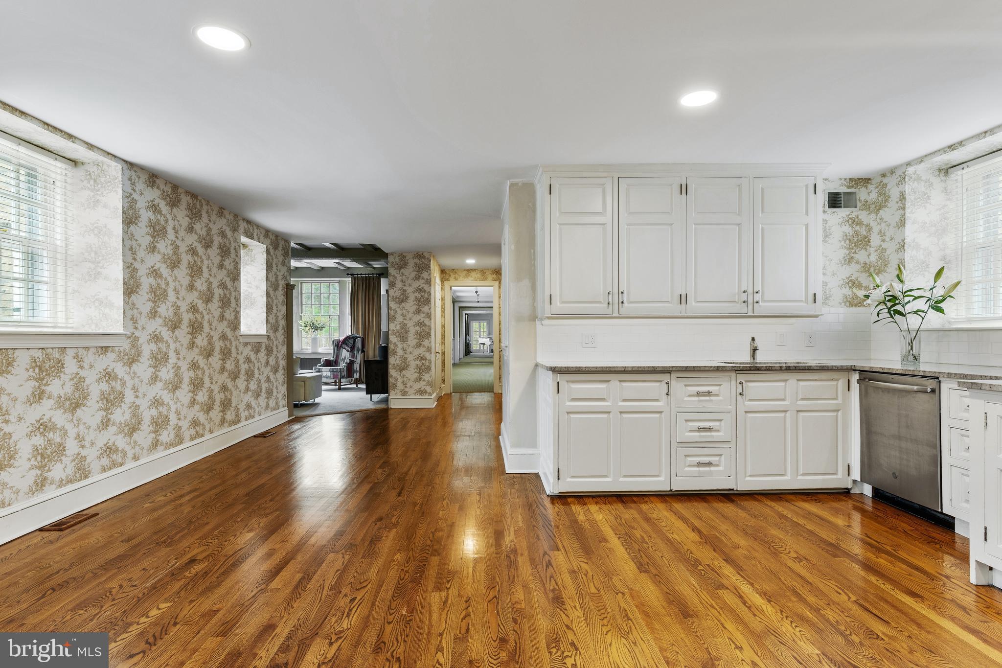 8201 Fenton Road Glenside, PA 19038 - Photo 58 of 86 a view of a kitchen with a sink and dishwasher with wooden floor