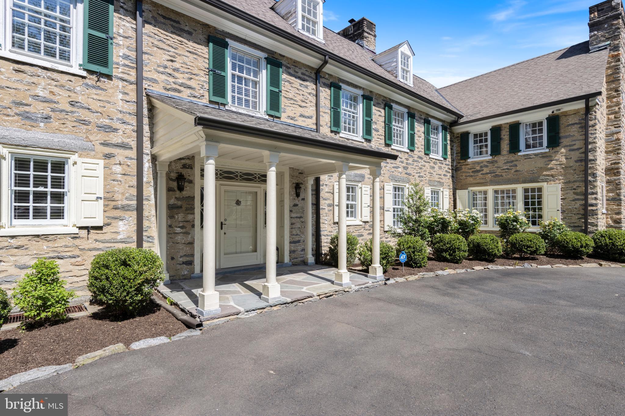 8201 Fenton Road Glenside, PA 19038 - Photo 6 of 86 front view of a brick house with a small yard