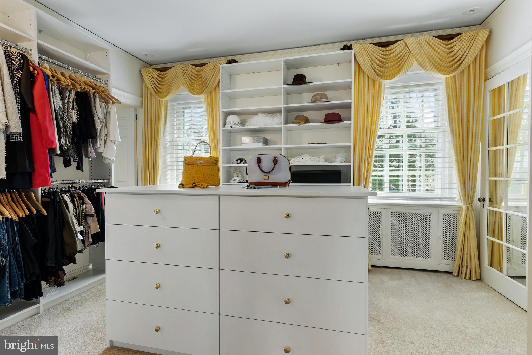 8201 Fenton Road Glenside, PA 19038 - Photo 70 of 86 a view of walk in closet with clothes and shoes