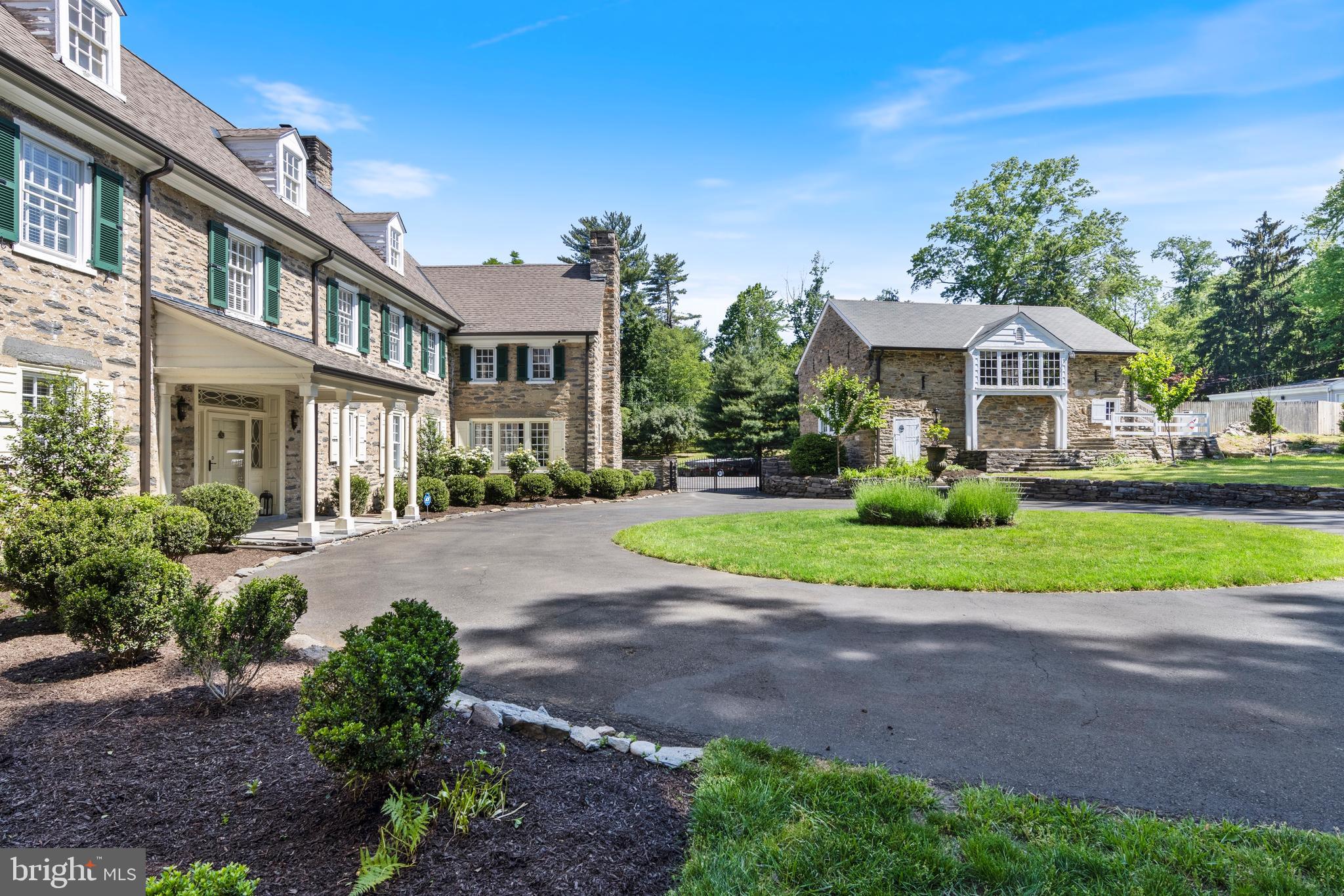 8201 Fenton Road Glenside, PA 19038 - Photo 7 of 86 a front view of a house with a yard and potted plants