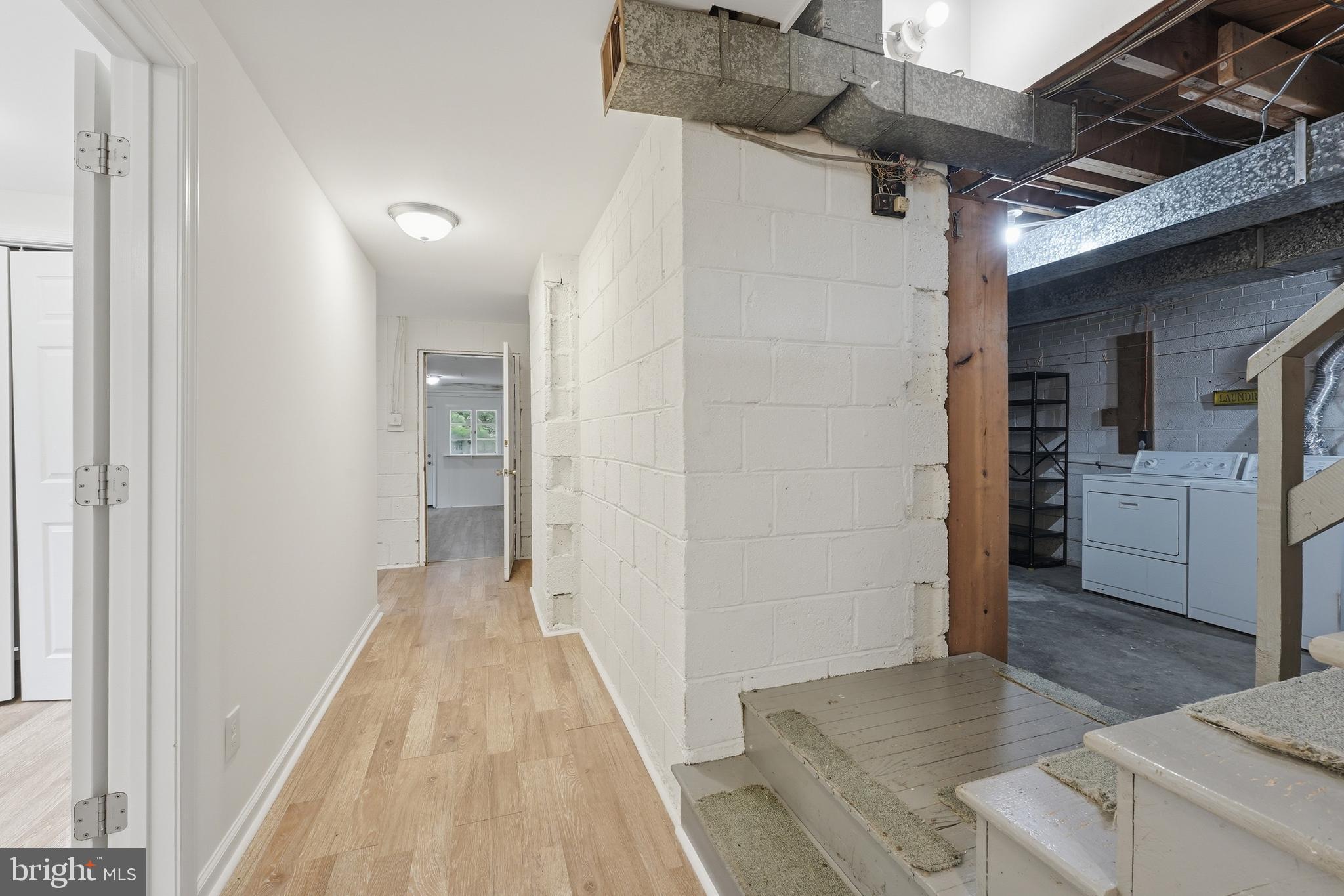 228 Northwest Terrace Silver Spring, MD 20901 - Photo 43 of 70 a view of a hallway view with wooden floor and a living room