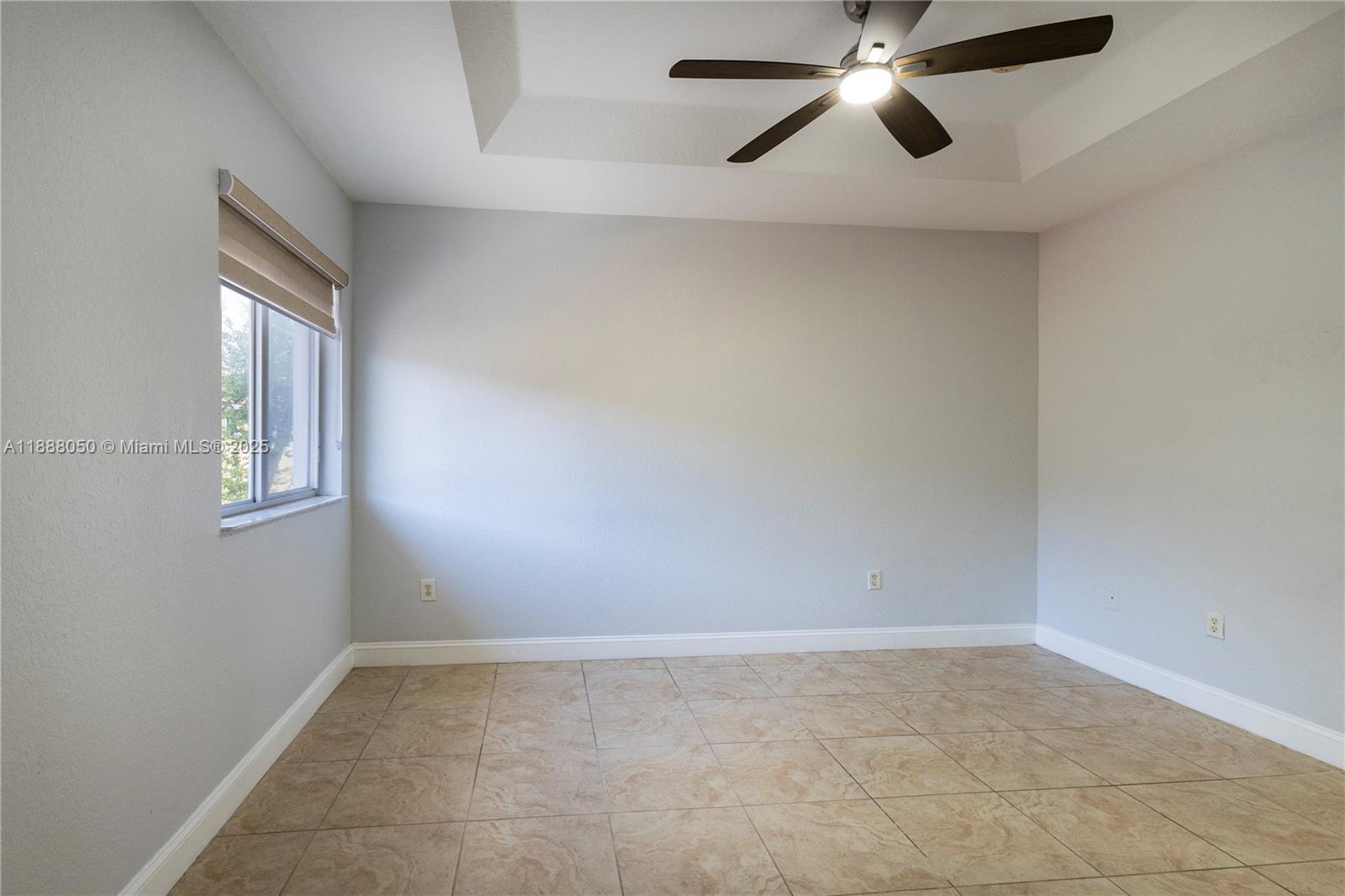 18038 Northwest 74th Court Hialeah, FL 33015 - Photo 17 of 39 wooden floor in an empty room with a window