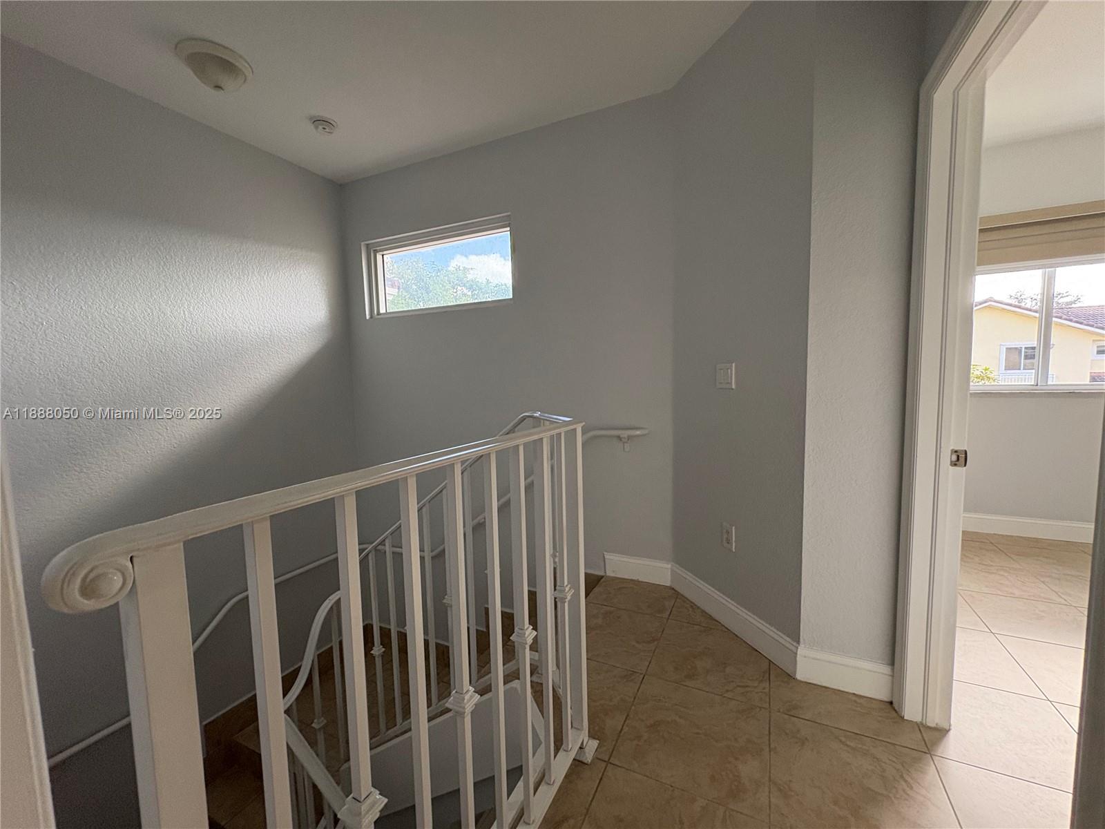 18038 Northwest 74th Court Hialeah, FL 33015 - Photo 22 of 39 a view of entryway with stairs