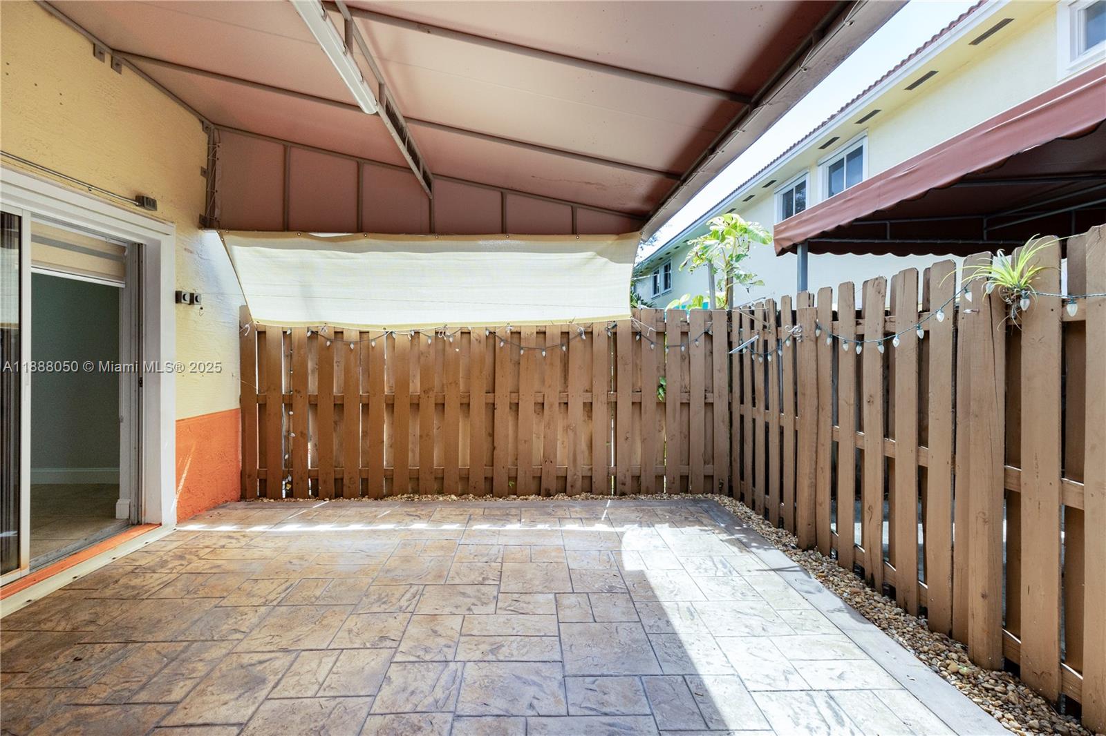 18038 Northwest 74th Court Hialeah, FL 33015 - Photo 26 of 39 a view of a backyard with wooden fence
