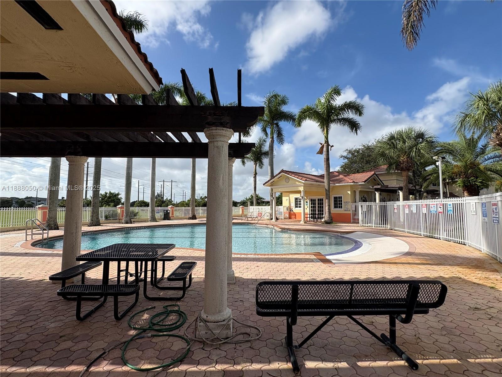 18038 Northwest 74th Court Hialeah, FL 33015 - Photo 35 of 39 a view of a chairs and table in patio