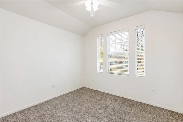 an empty room with closet area